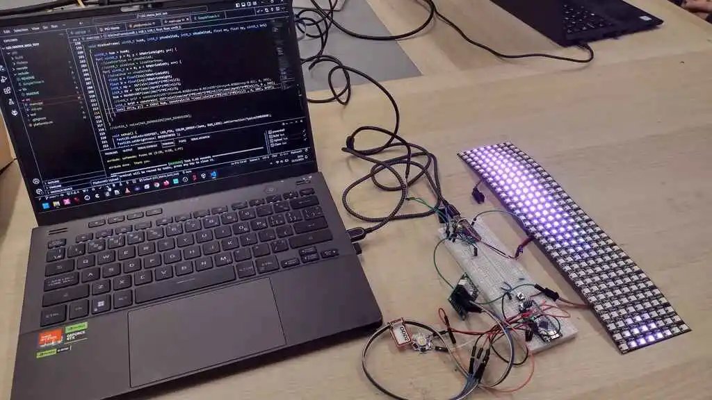 picture of laptop connected to electronics connected to large 2D LED strip